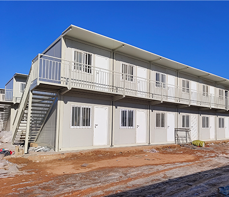 Casa contenedor de paquete plano